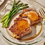 Get ready for a delicious dinner with these juicy Instant Pot Pork Chops. This recipe features bone-in pork chops coated in a flavorful spice rub and cooked in a delightful whiskey gravy. It’s a quick meal that pairs beautifully with asparagus or baked potatoes!